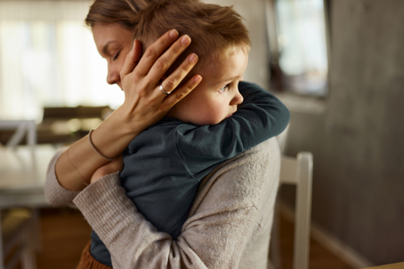 woman hugging child